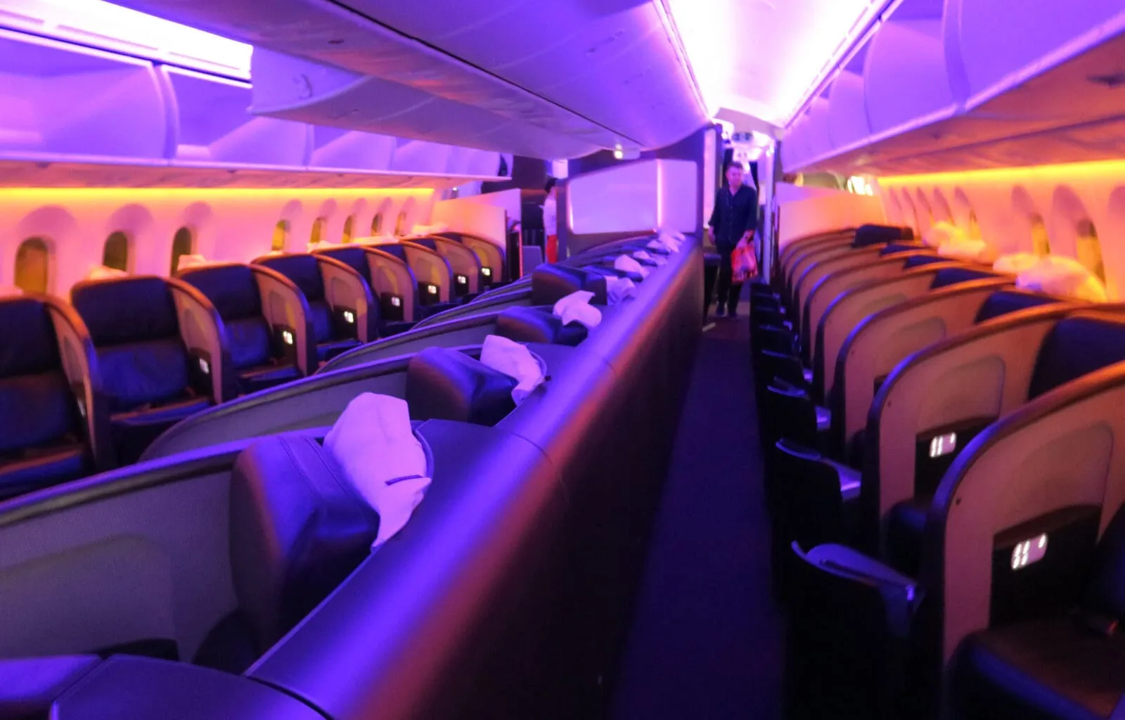 a person standing in a row of seats