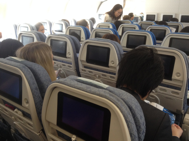 a group of people sitting in an airplane