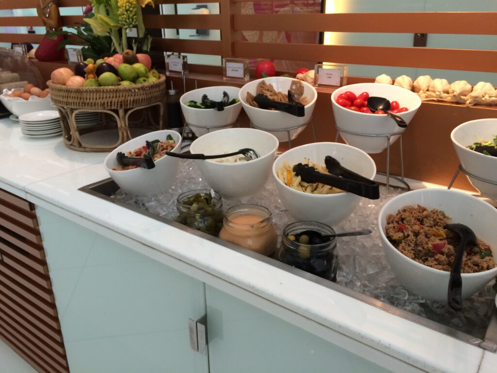 a buffet with bowls of food