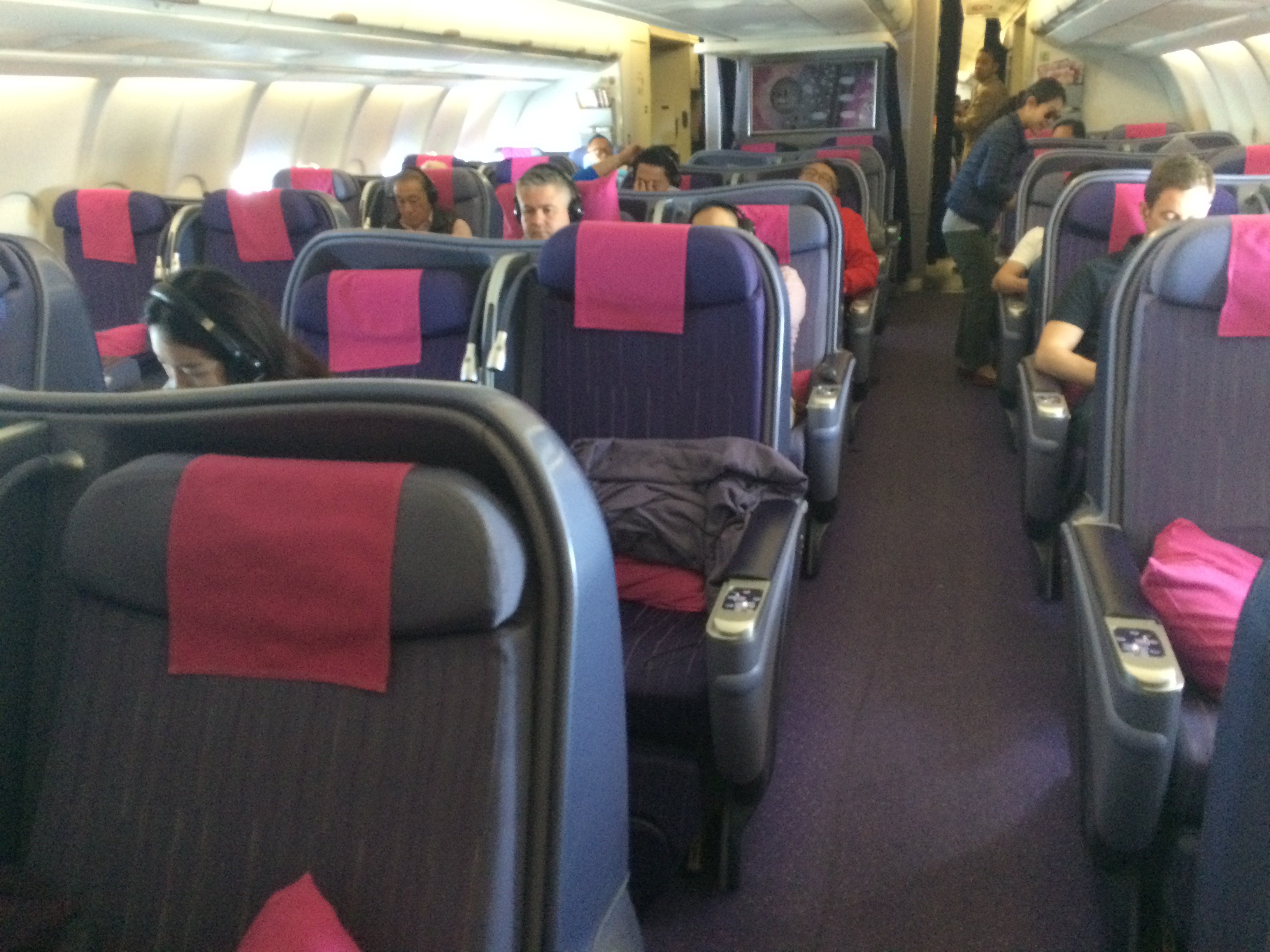 a group of people sitting on a plane