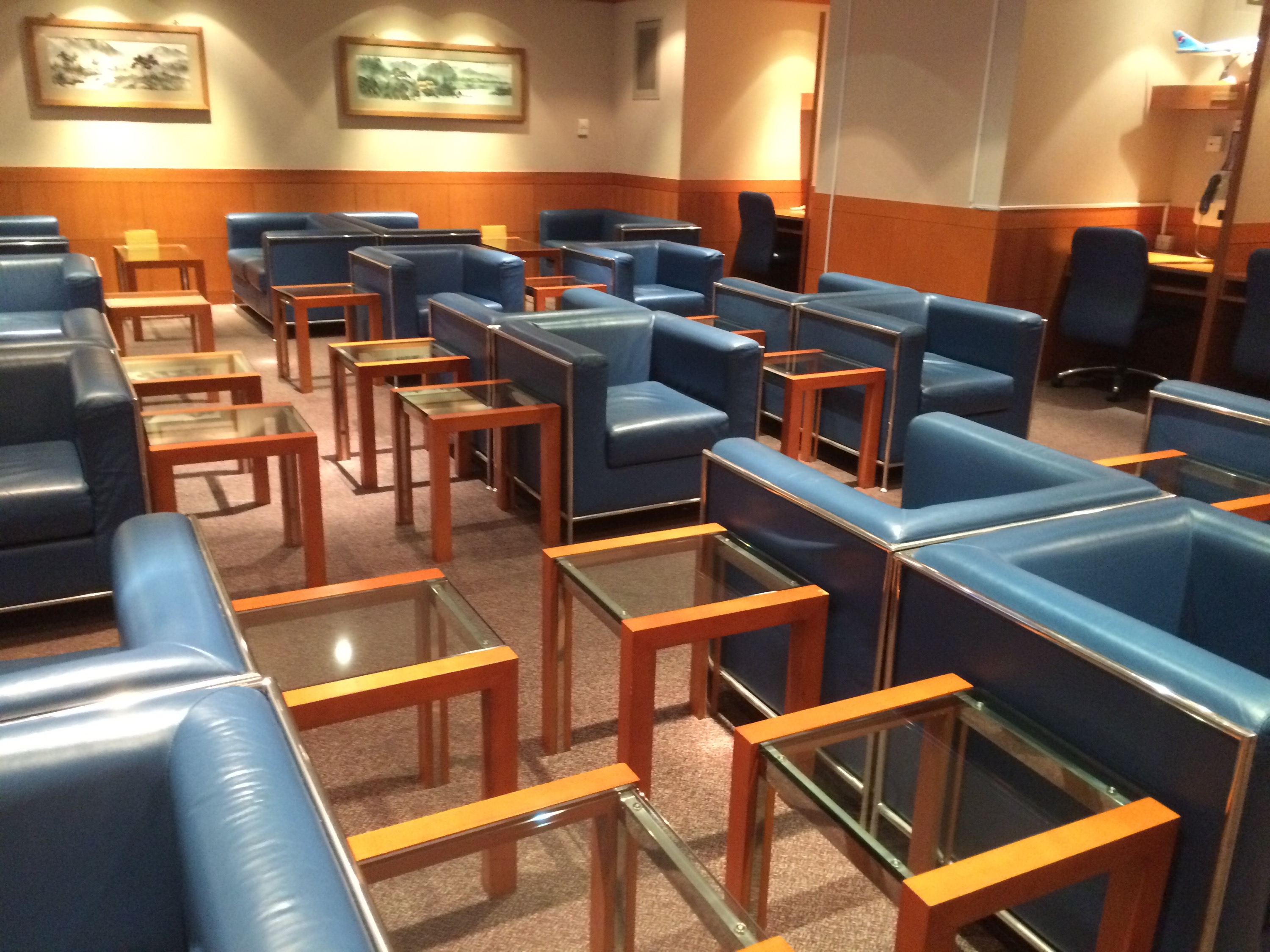 a room with blue chairs and tables