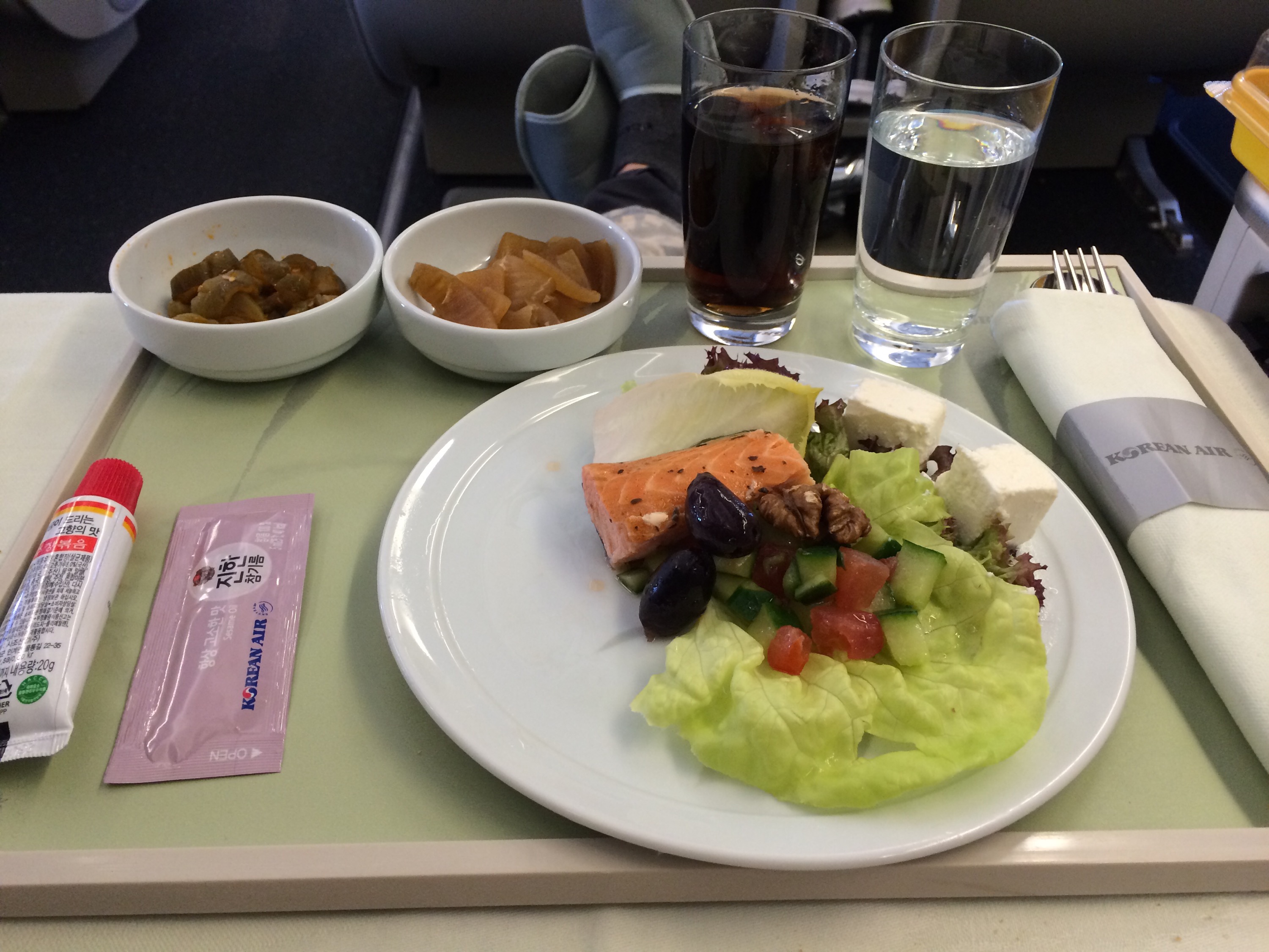 a plate of food and drinks on a tray