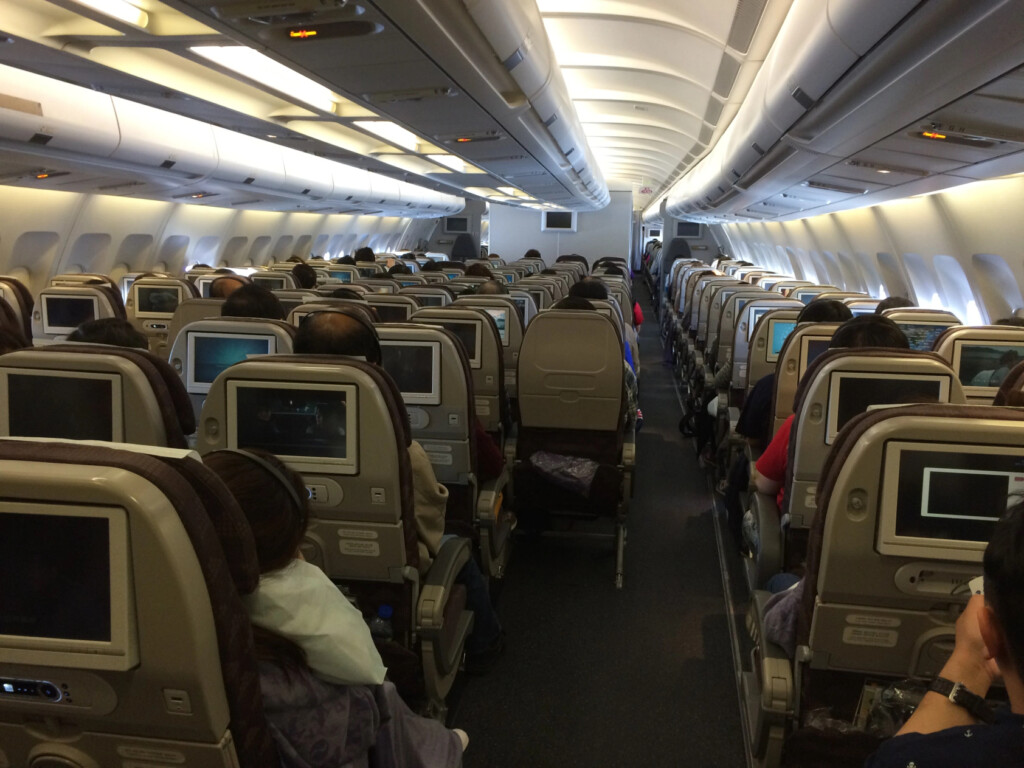 a group of people sitting in an airplane