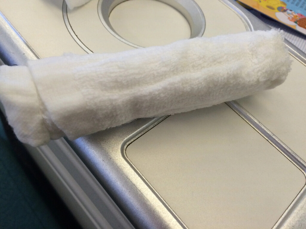 a white towel on a white surface