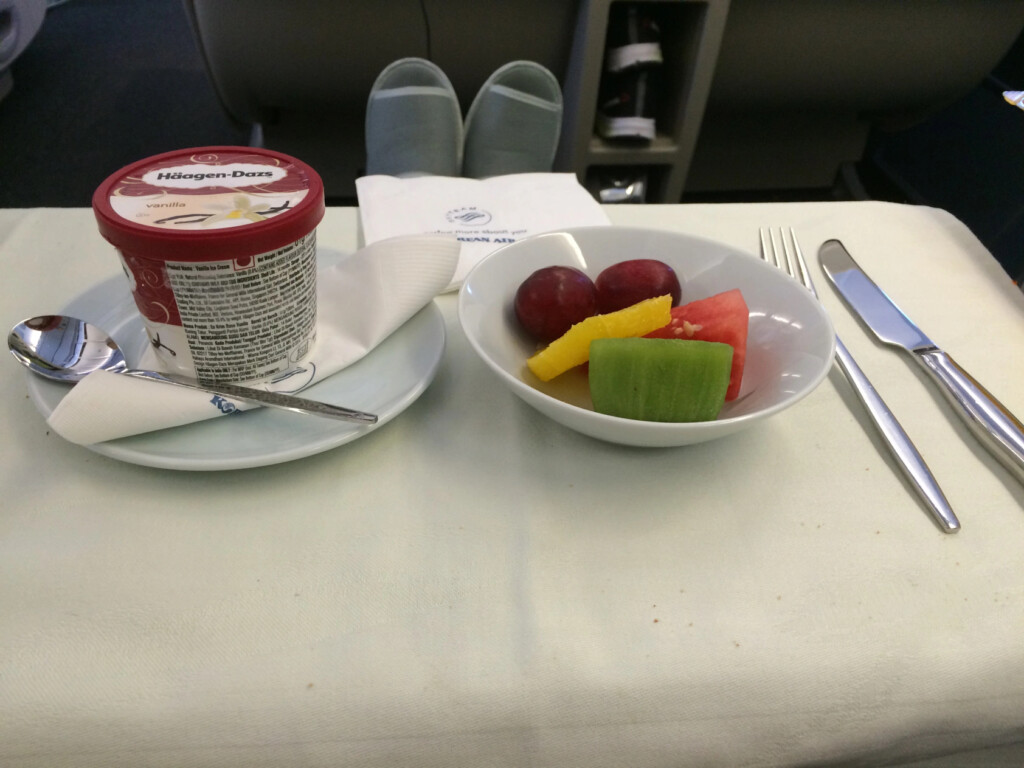 a bowl of fruit and yogurt on a table