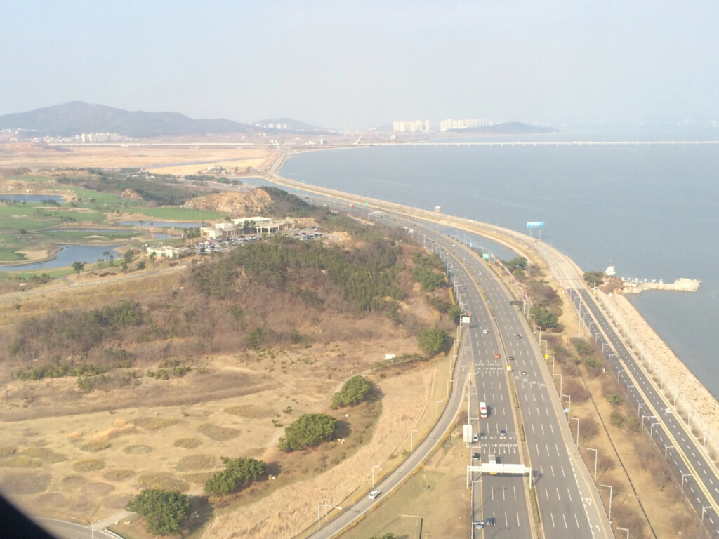 a highway next to a body of water