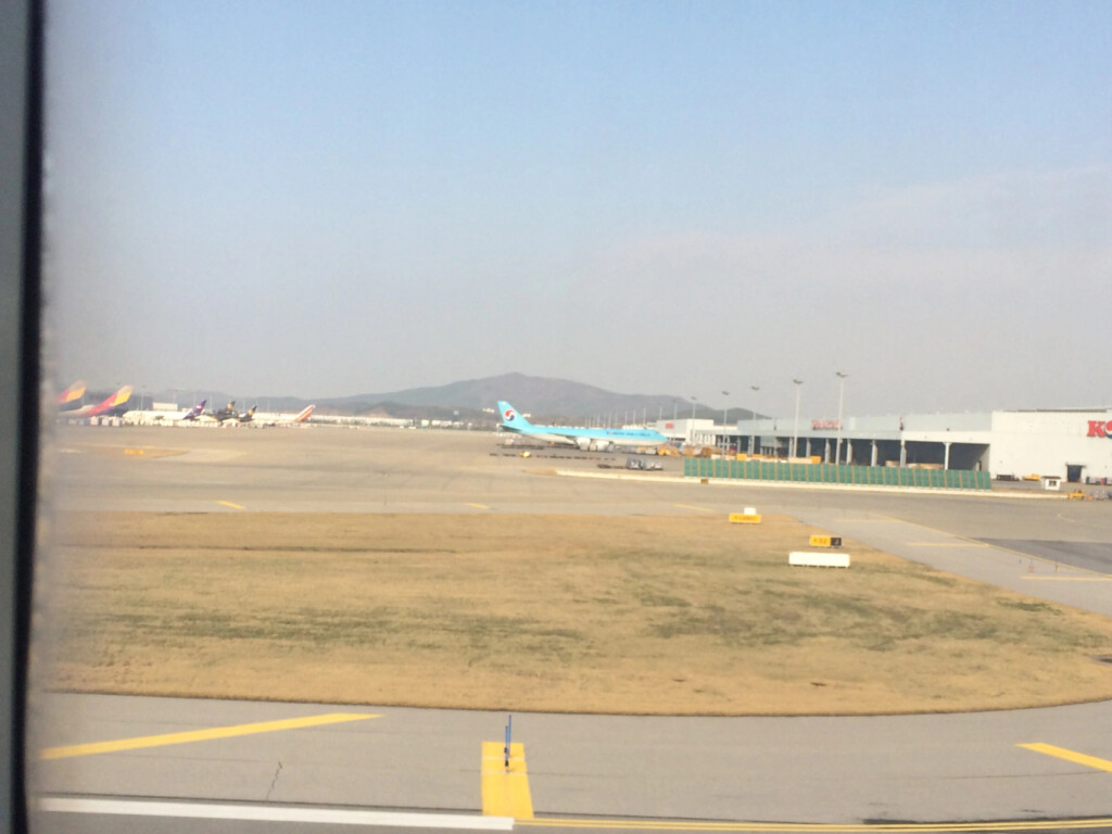 an airport with airplanes on the runway