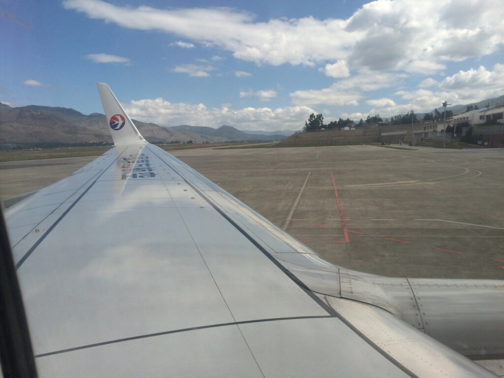 an airplane wing on a runway