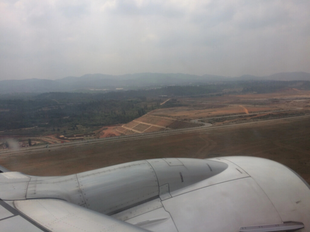 an airplane wing and a landscape