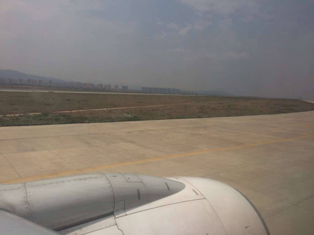 an airplane wing on a runway