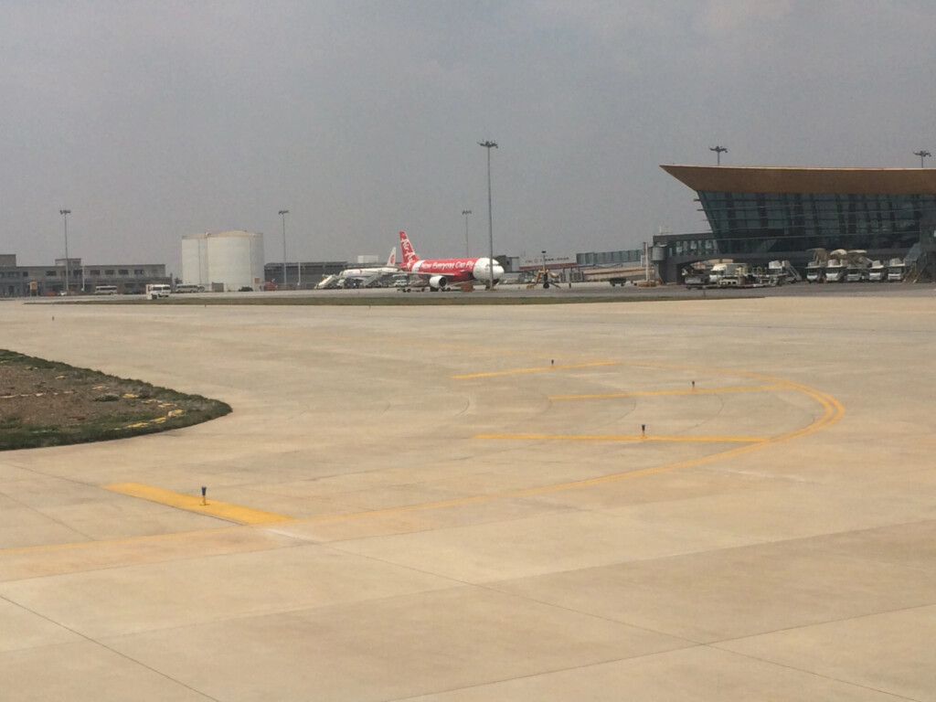 an airport with airplanes on the runway