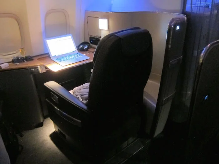 a laptop on a desk in an airplane