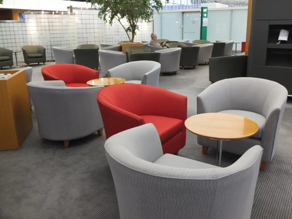 a group of chairs and tables in a room