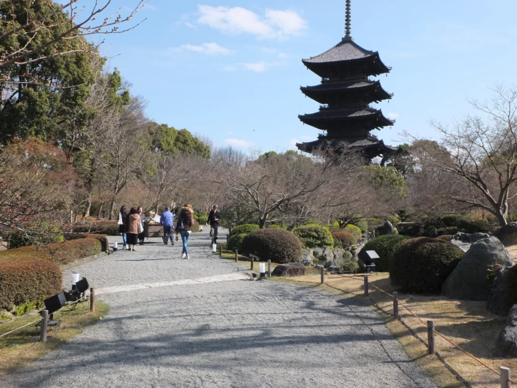 a path with a pagoda in the background