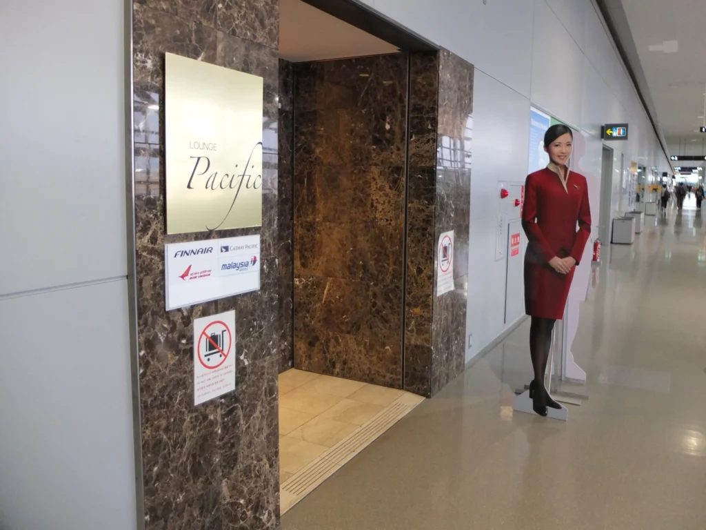 a woman standing in front of an elevator