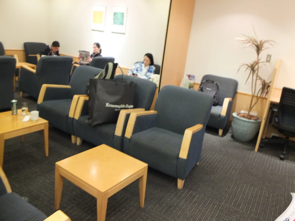 a group of people sitting in a waiting room