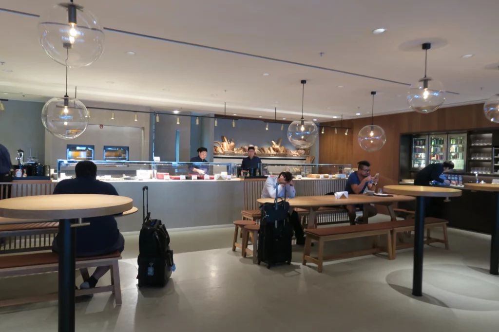 people sitting at tables in a restaurant