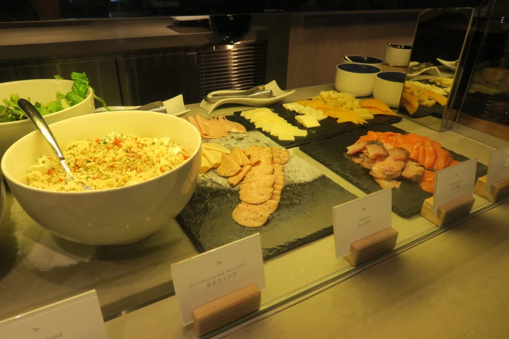 food on a counter with plates of food