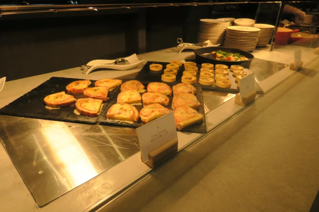 food on a counter with plates and plates