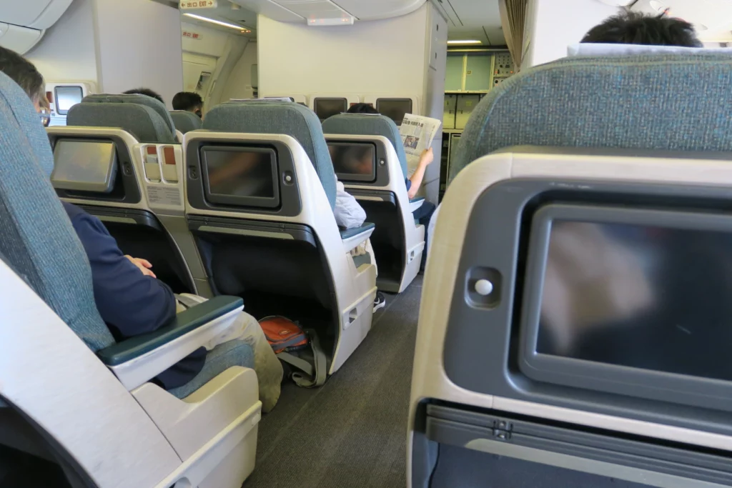 a group of people sitting in an airplane