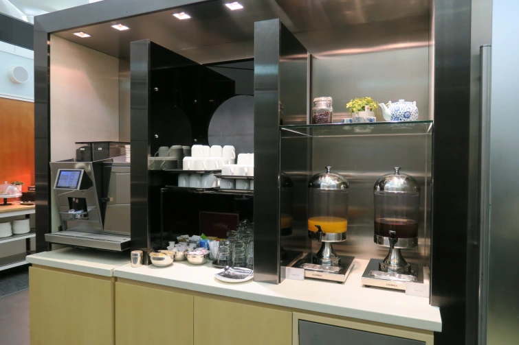 a counter with a variety of coffee machines