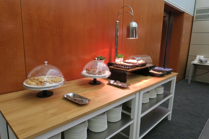 a buffet table with plates and food on it