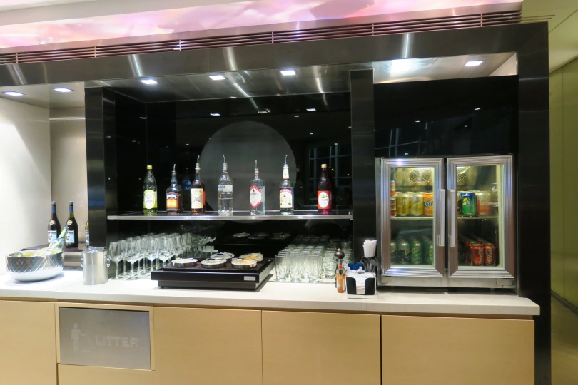 a bar with drinks and beverages