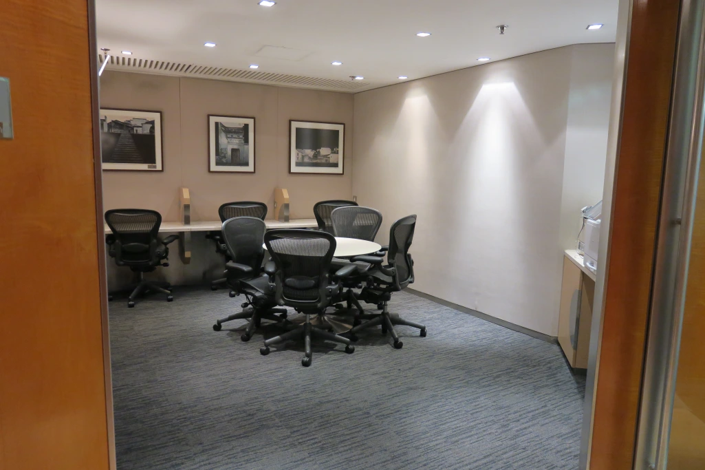a room with a table and chairs