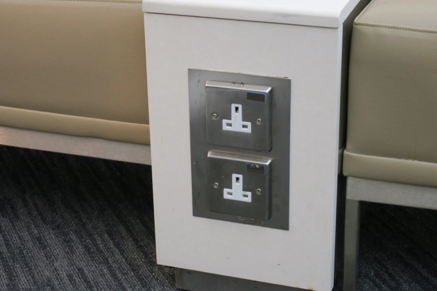 a white box with silver buttons