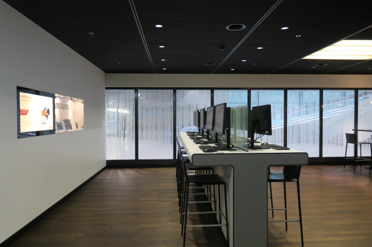 a room with computers on a table