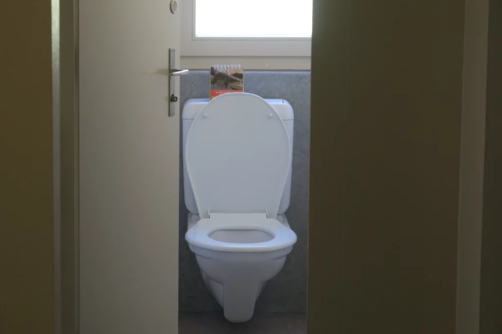 a toilet with the lid up