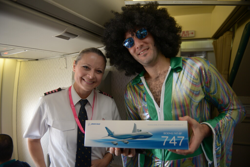 a man and woman holding a box