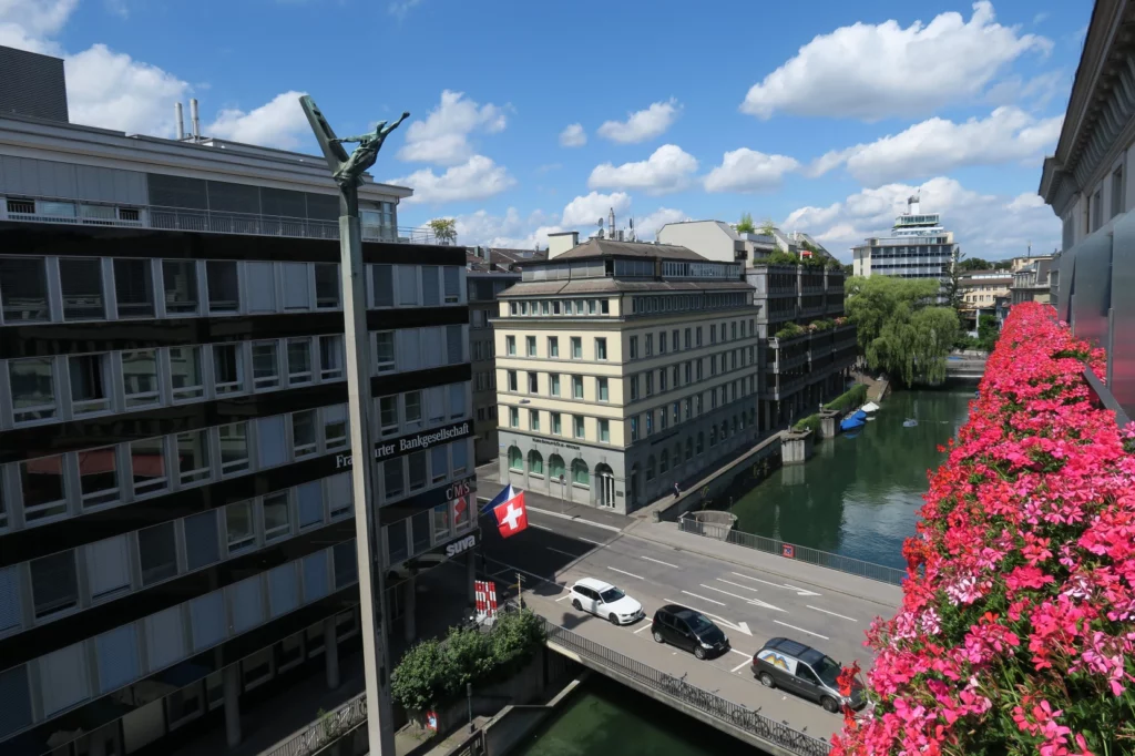 a river with cars and buildings