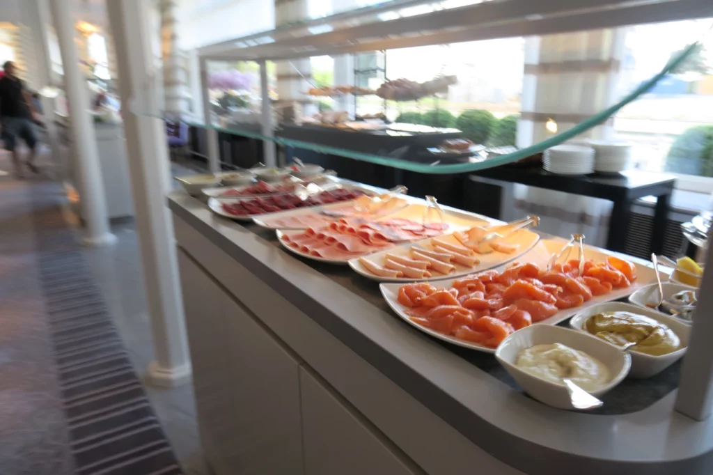 a buffet with different types of food on plates