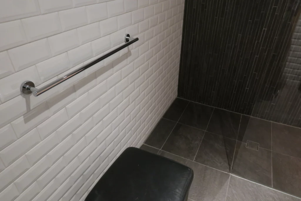 a black seat in a bathroom