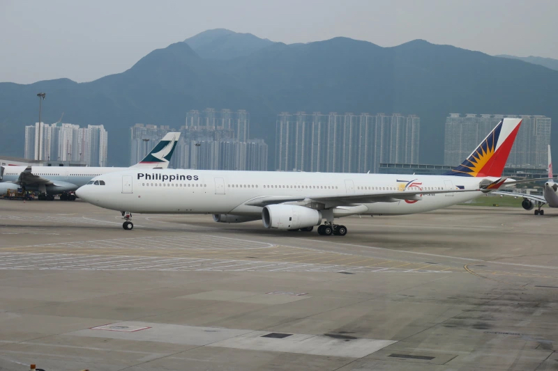 a white airplane on a runway