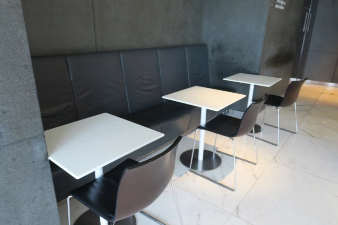 a group of tables and chairs in a room
