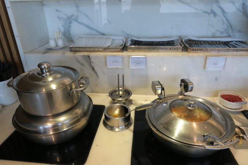 a kitchen with a pot and a pan on a stove