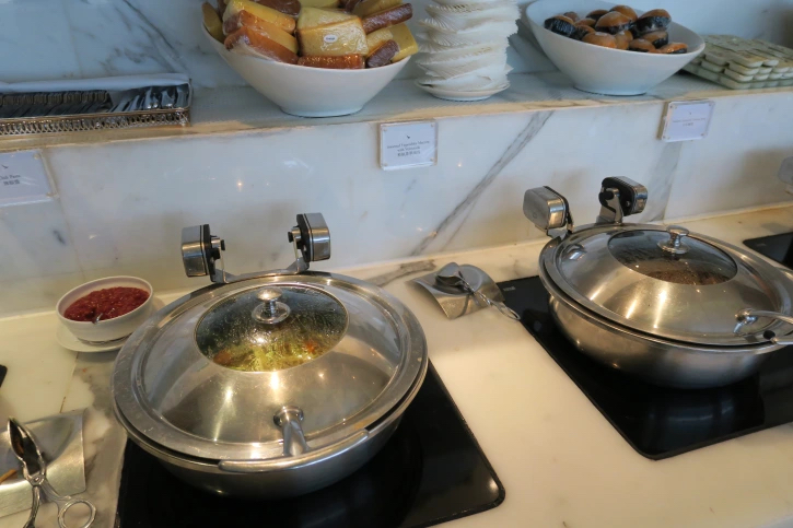 a group of bowls of food on a counter