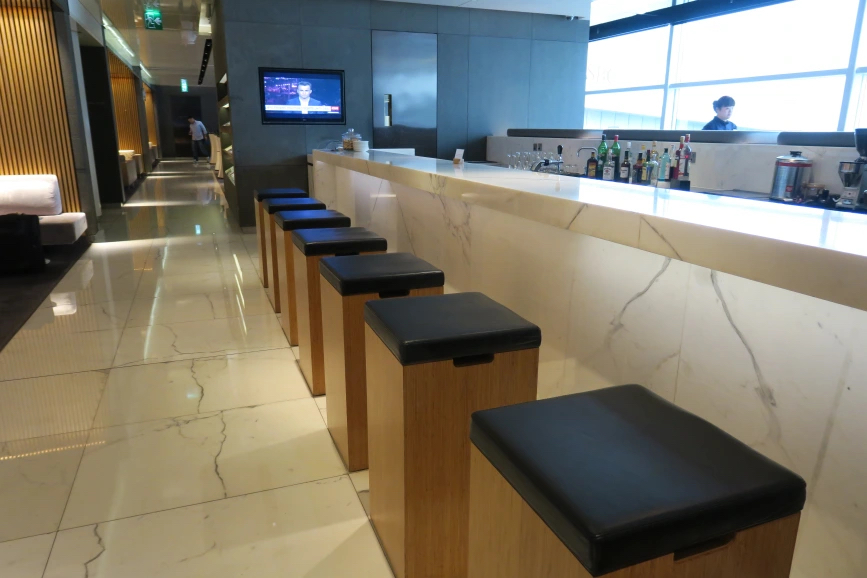 a row of stools in a bar