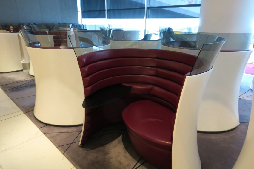 a red and white booth with glass walls