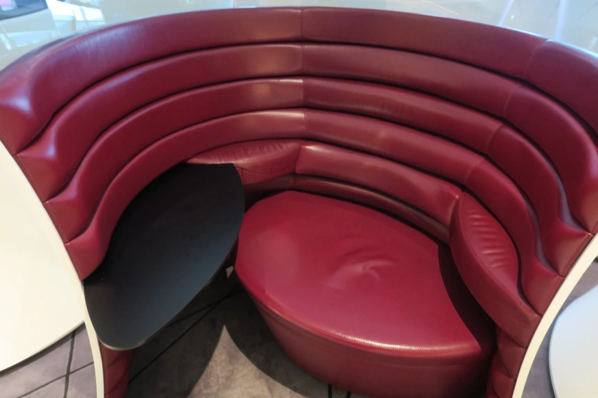 a red booth with a table