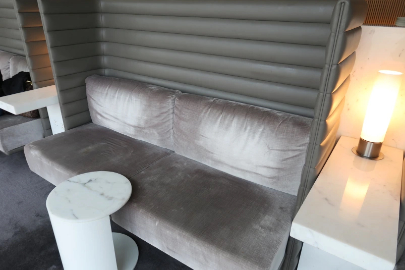 a couch with a table and a lamp