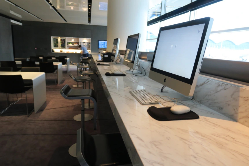 a room with computers and chairs