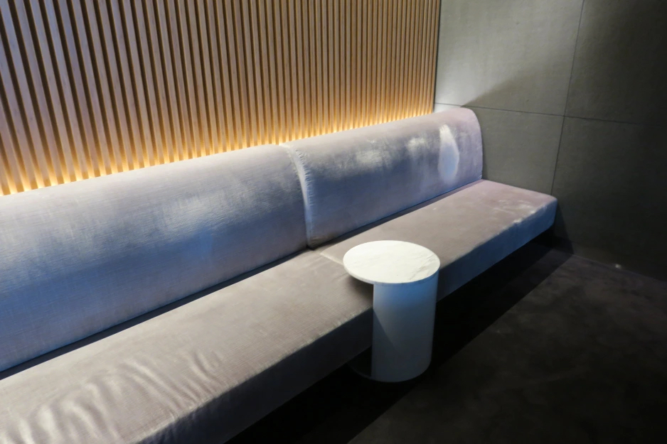 a white couch with a round table