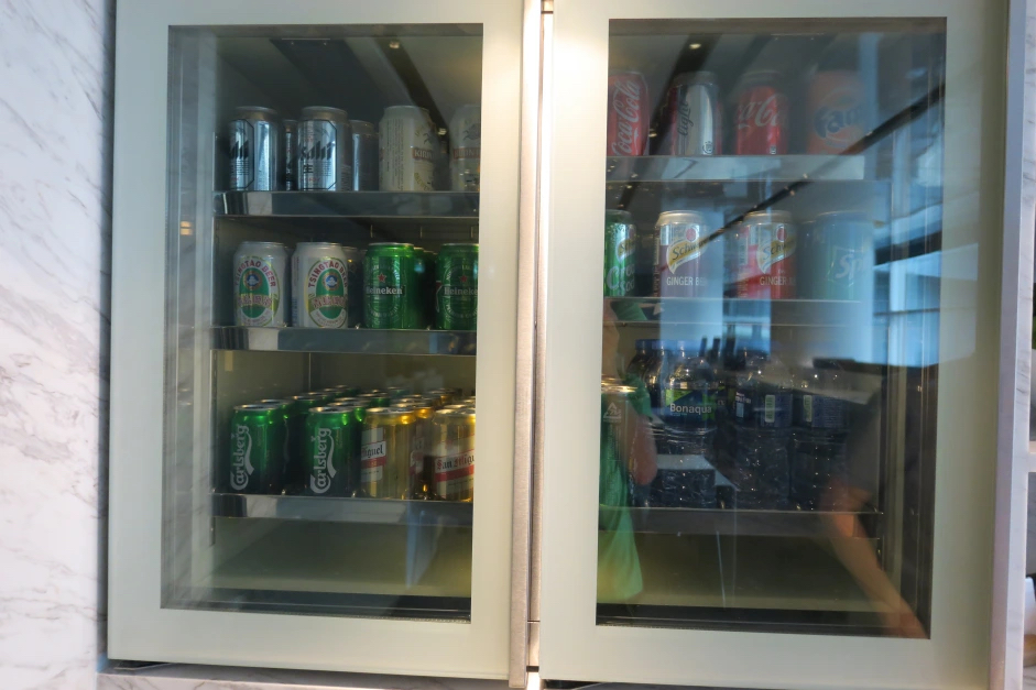 a refrigerator with cans of beer