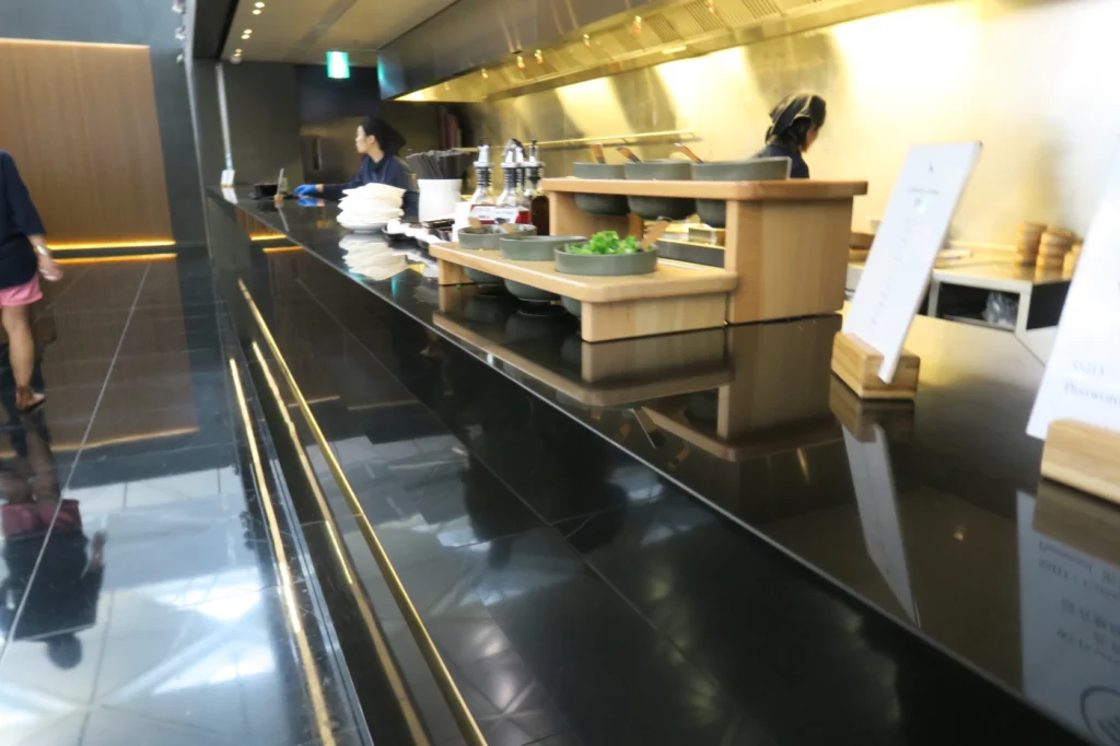 a kitchen with a black countertop