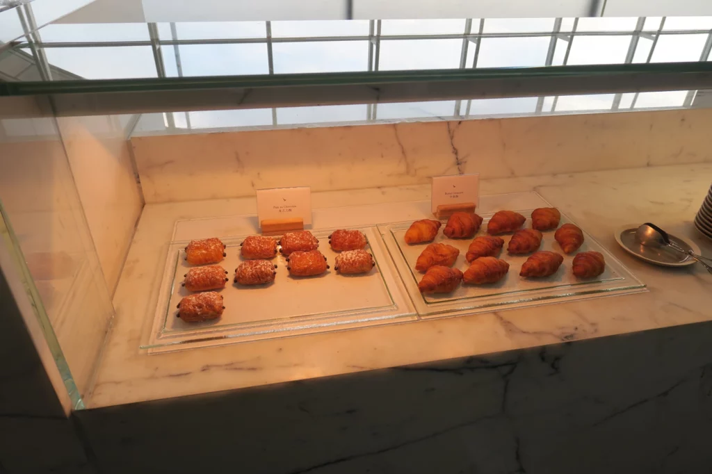 a display case with pastries on it