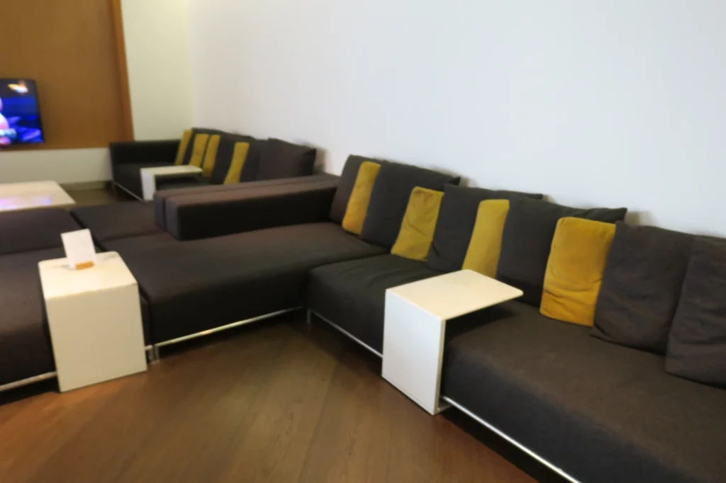 a couch with yellow pillows