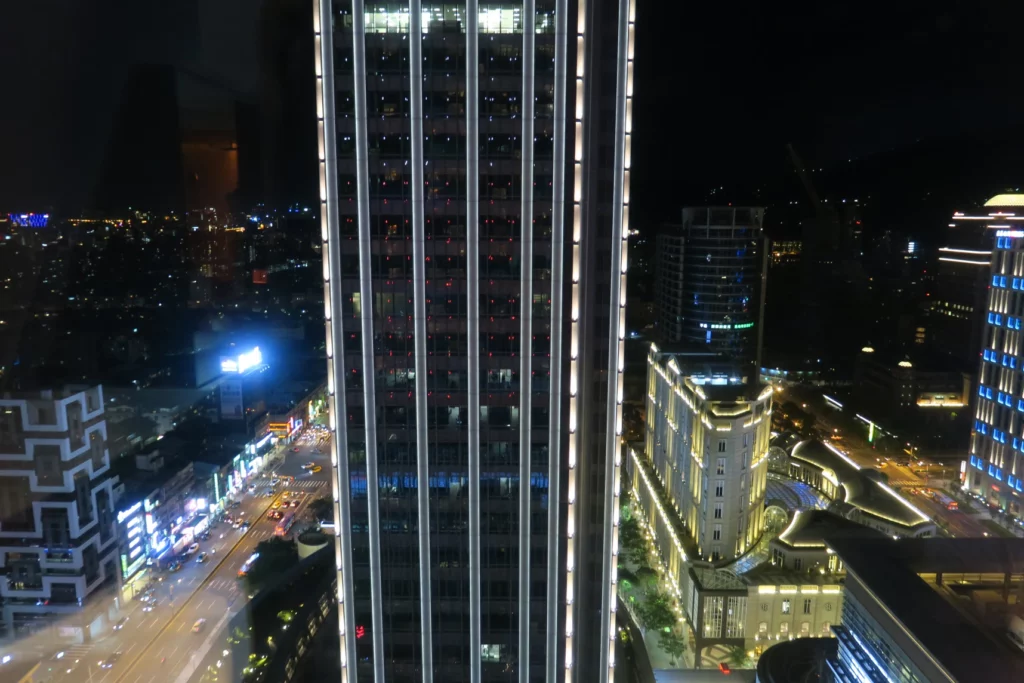 a tall building with lights at night